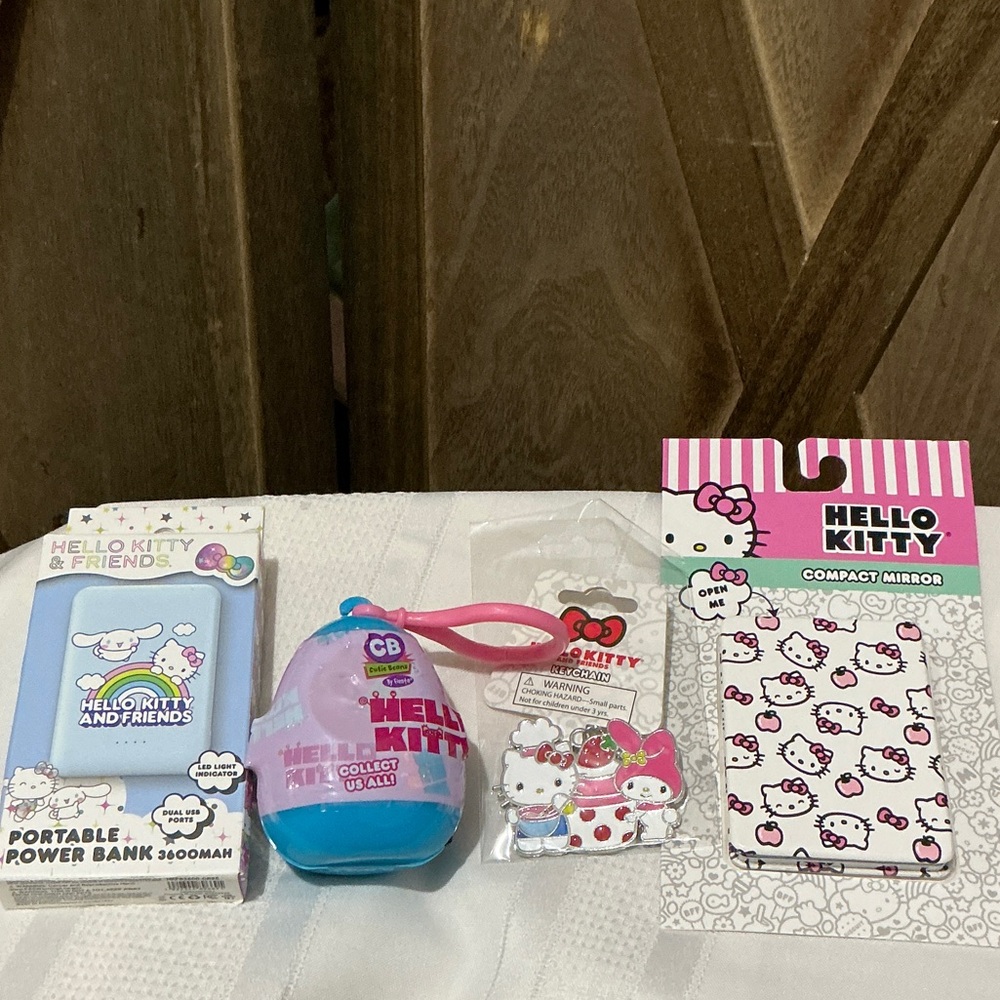 NIP Hello Kitty 4pc Bundle. Power Bank, Bag Charm, Compact Mirror, and Keychain